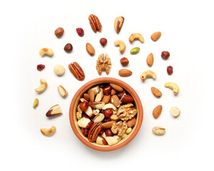 Walnut, macadamia nut, cashew nut, pecan on the plate and isolated on white background. Pile of mixed nuts on the light background.