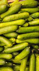 Cucumbers background. Cucumbers on store shelves. Vegetables in the store