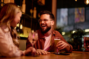 Joyful Friends Enjoying Drinks at a Cozy Bar