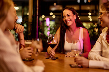 Friends Enjoying a Night Out at a Cozy Restaurant