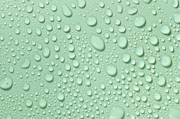 Cosmetic moisturizing liquid drops on green blue pastel background. Toner or lotion. Hyaluronic serum