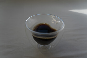 A heart-shaped mug with instant coffee. Coffee background