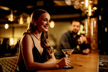 Attractive Woman Enjoying a Night Out at a Chic Bar