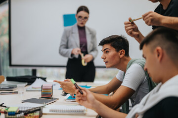 Students actively participate in a classroom while engaging in hands-on activities. A teacher guides the diverse group as they collaborate on a creative project, fostering teamwork and innovation.