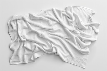 A clean white towel laid flat on a white surface, great for representing purity and simplicity