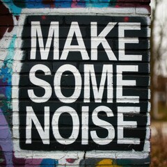 Obraz premium Word ‘Make some noise’ written in graffiti-style lettering with spray paint effect isolated on transparent background 