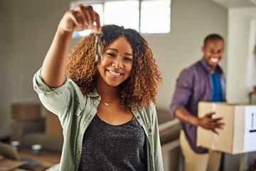 Couple, portrait and keys in new home, ownership and investment in relax estate property. People,...