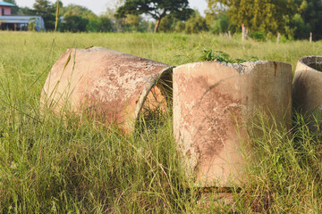 Large cement pipes covered with green grass