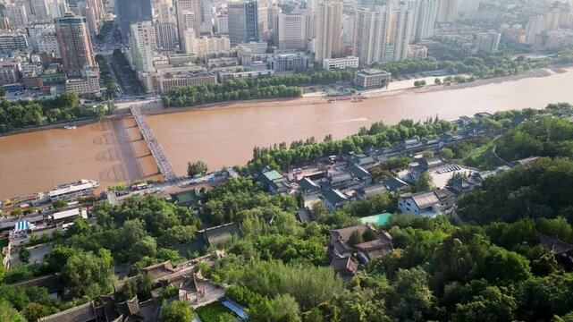Luzhou, China: Aerial drone footage of the Baita temple and pagoda on the Baitashan hill on the other side of the Yellow river in Lanzhou in Gansu, China. Shot with a backward revealing motion