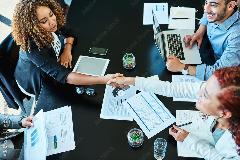 Poster Office, above and business people in meeting with handshake, partnership and teamwork for project. Boardroom, employees and accountants with shaking hands for b2b agreement, investment deal and smile