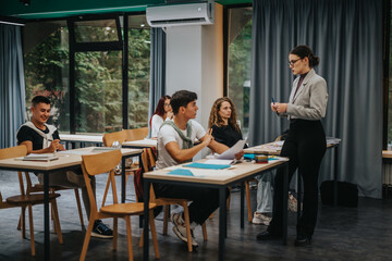 A group of students attentively participates in a classroom session, interacting with a teacher. The scene captures a vibrant academic atmosphere with engaged learning and communication.