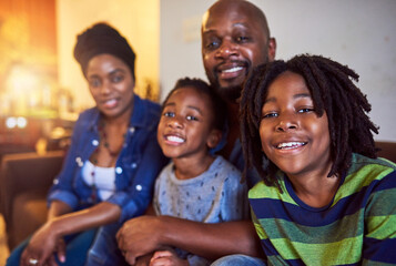 Black family, portrait and smile in home living room for love, bonding or relax on sofa together. Children, parents and people in apartment, lounge or house for peace and support for childhood fun