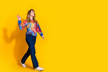 Fototapeta premium Photo portrait of young funny blonde hair adorable woman friendly waving hand to empty space isolated on yellow color background