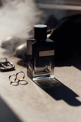 Grooms accessories for wedding, rings, shoes in smoke. Wedding day