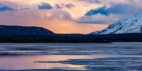 Stunning Sunset Over Snowy Mountain and Calm Lake