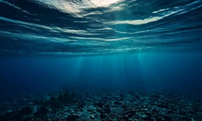 Sunlight beams through deep ocean waters, creating a serene and mysterious underwater atmosphere.

