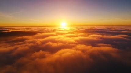 Fototapeta premium Serene Sunrise Over Rolling Clouds