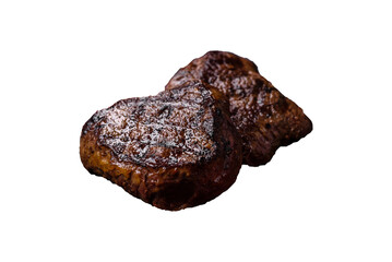 Juicy beef steak baked on the grill with salt, spices and herbs