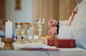 Catholic priest performing the sacrement of the Eucharis