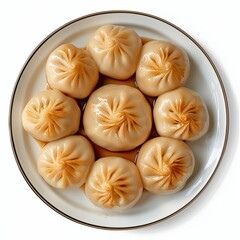 Cut-out top view food photography of a plate of bakpao isolated on a white background