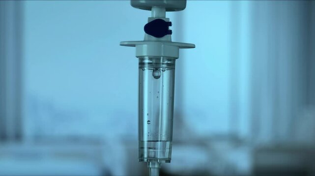 Dripping saline, Dripping medical perfusion close up equipment in clinic background, Medical equipment, Saline Solution IV Drip Fluid for Infusion in Hospital. Intravenous drip in operation room.
