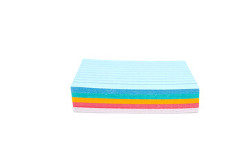 A stack of colored note paper with a blue top on a transparent background. The paper is multi-colored and has a striped pattern.