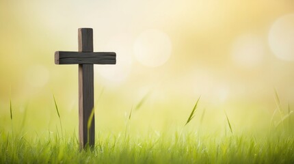 A Wooden Cross Standing Alone in a Serene Green Field at Sunset