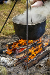 burning wood in the hearth under the boiler, fire, lunch, cooking, nature, rest, hiking, scouts