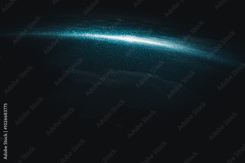 Wall mural a dark sky with a bright blue streak in the middle. the blue streak is surrounded by a white line