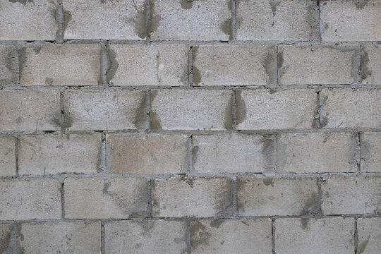 A cinder block wall texture with gray and white colors