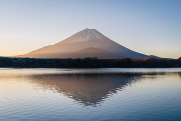 Sunrise with boats on the lake Shoji with mount Fuji in Background