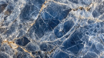 Obraz premium Close-up of a blue marble with white and gold veins, perfect for use as a background or texture.