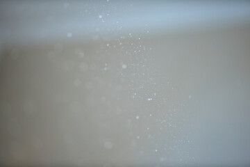 Dust, small particles fly through the air in the sunshine. selective focus