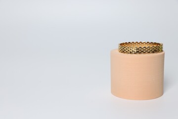Stylish presentation of beautiful bracelet on light background. Space for text