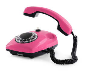 Old pink telephone with rotary dial isolated on white