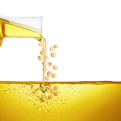 Vegetable oil and soy beans pouring from glass jug on white background
