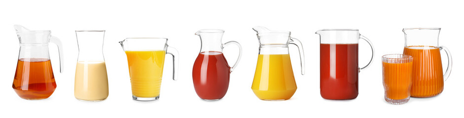 Glass jugs with different juices isolated on white, set