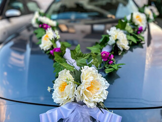 Car decoration for a wedding, decorations on the car of the newlyweds