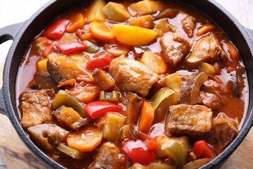 Delicious stew with vegetables in pot on table, closeup