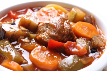 Delicious stew with vegetables in bowl, closeup