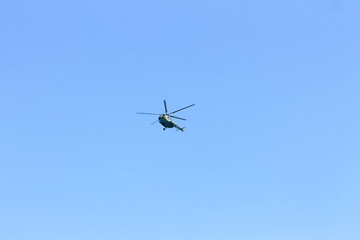 military helicopter in flight