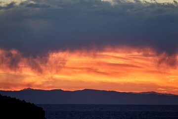 stunning sunset over Suasi Island. The sky transforms into a canvas of colors, reflecting the beauty and serenity of this magical place. Titicaca Lake Peru