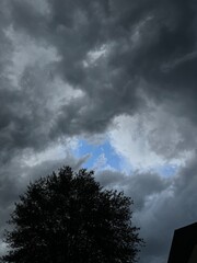 Dark Storm Clouds Blue Sky Peeking