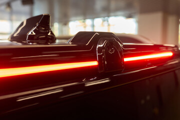 Naklejka premium Closeup of a cars automotive tail brake light