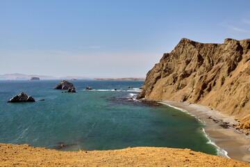 Obraz premium The Paracas National Reserve is a vast protected area that encompasses both land and sea. It is famous for its otherworldly desert landscapes, rugged cliffs, and unique geological formations