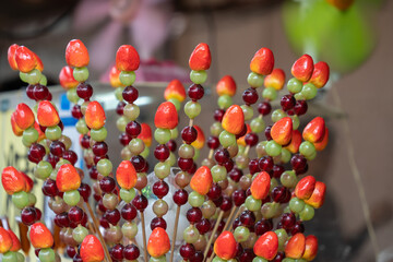 Fruit skewers with sugar coating selling at a food stall. It also known as Tanghulu.