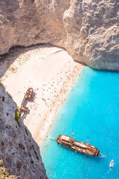 Aerial view of shipwreck beach in summer with people. Zakynthos, Greek Islands, Greece