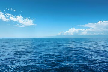 Fototapeta premium A large body of water with some clouds in the sky