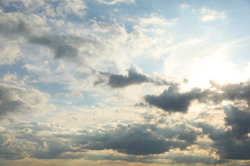 Sun shining through clouds on beautiful sky