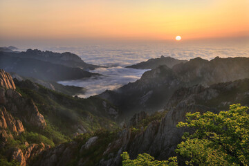 The sun rising over the sea of clouds seen from the Dinosaur Ridge at Mt Seoraksan, Korea